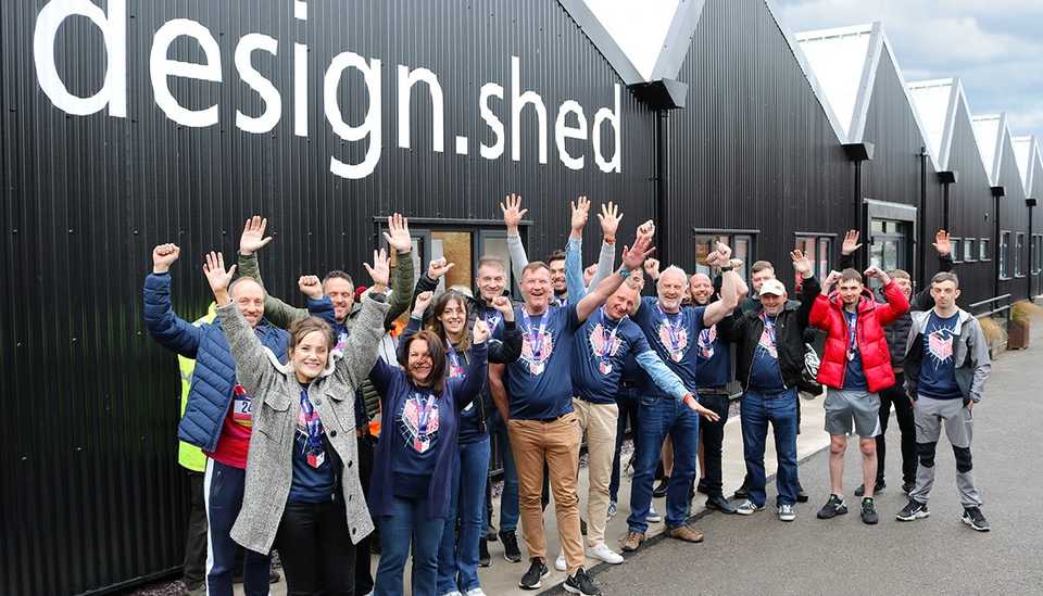 All 18 Manchester Marathon runners received a warm welcome when they returned to the design.shed in Saltney